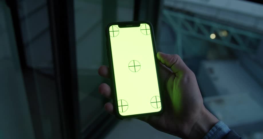 Mans hand holding smartphone