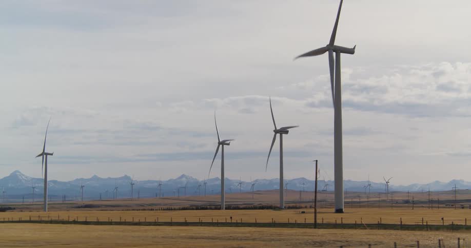 Wind turbines are spinning on a wind farm