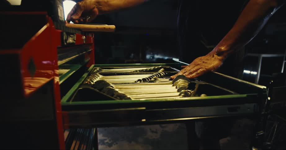 Mechanic looking at tools
