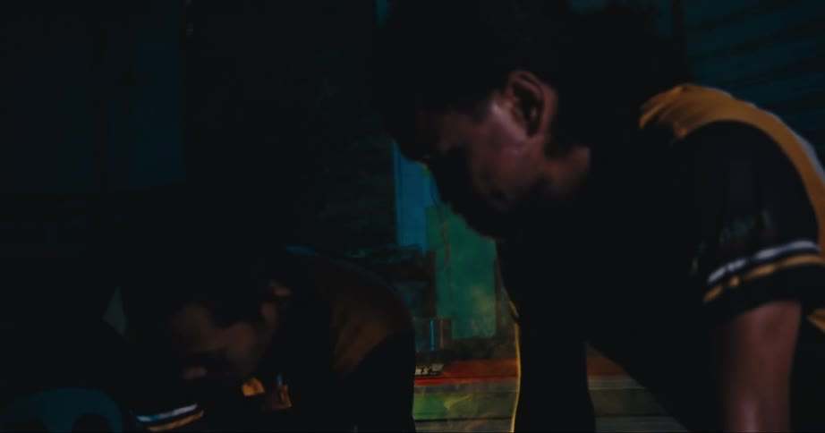 Two men are looking at something they are working on