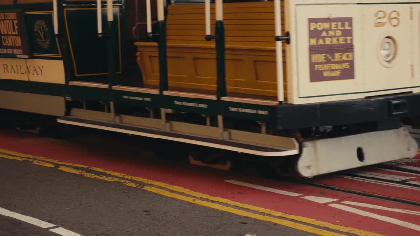A trolley drives down the street