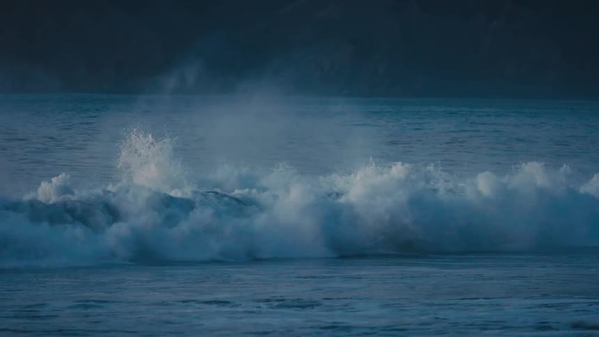 Waves crash against the shore