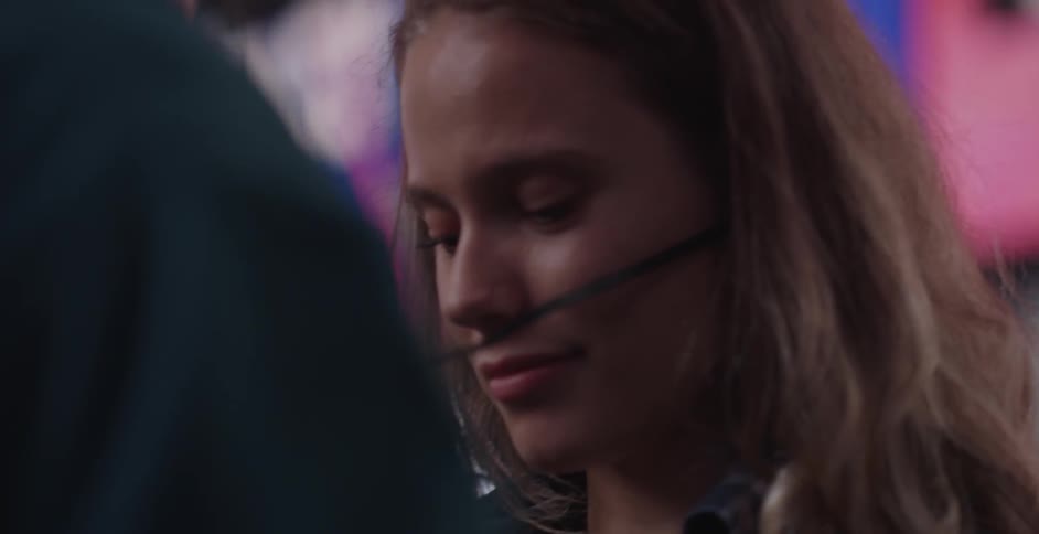 A woman looks up at someone smiling
