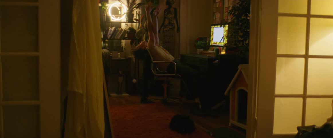 A person dancing getting up from a table
