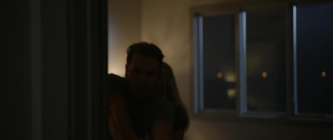 A man grabs a gun and goes down the hall