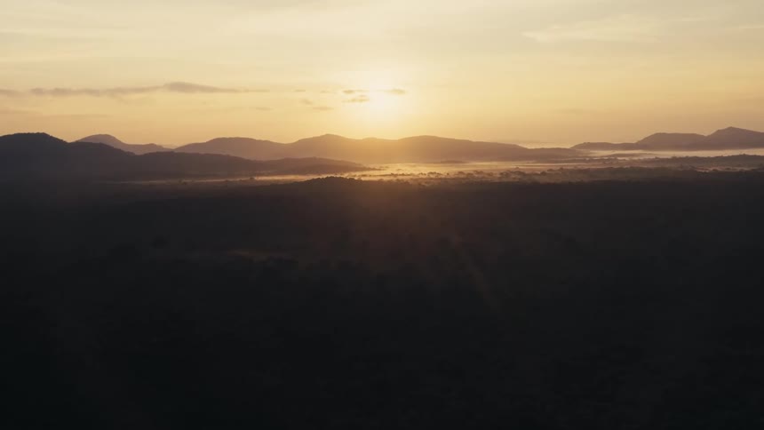 An aerial view of a landscape with hills in the distance