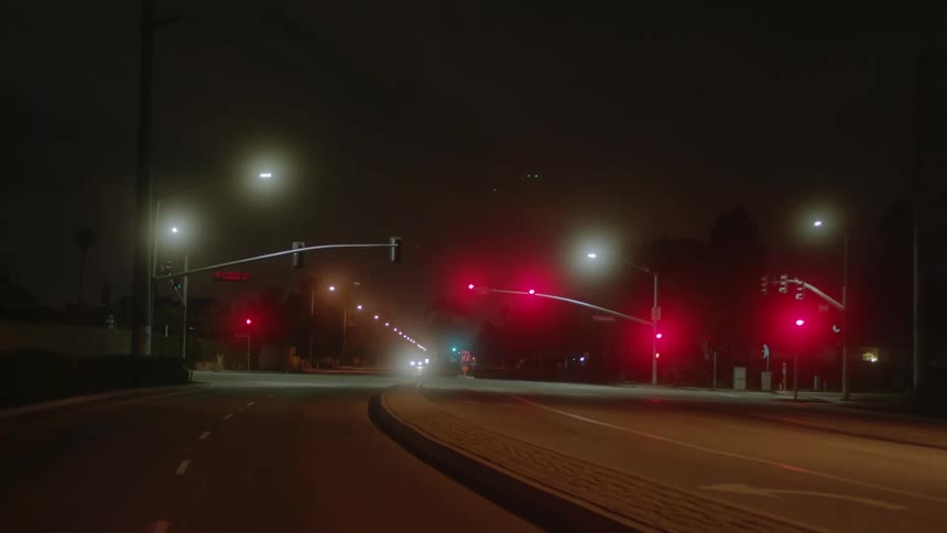 Driving down a road at night