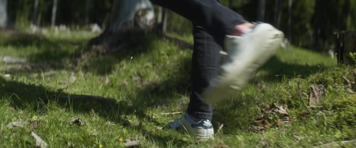 A man walks through a forest