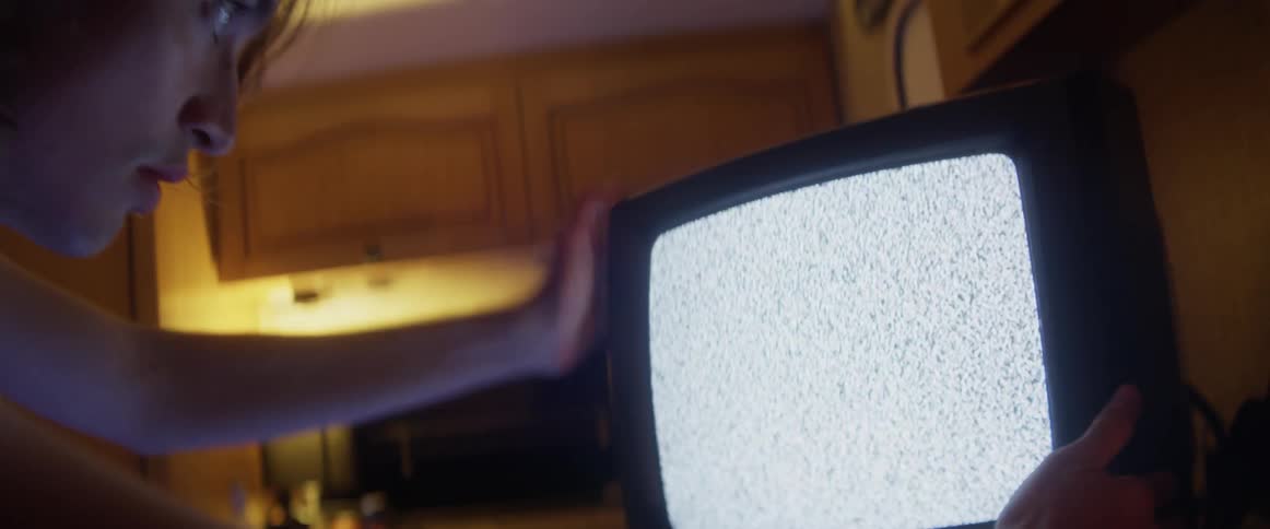 Person hitting tv