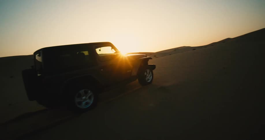 Car driving on sand