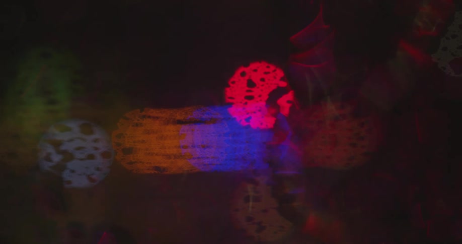 A view of lights flashing in the distance out of focus