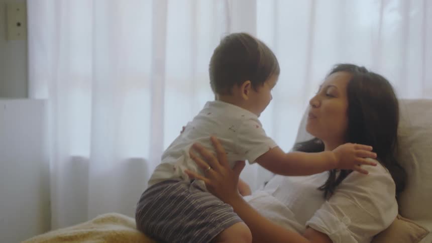A mother and son playing