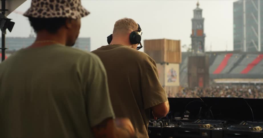 A dj putting on a show at a stadium