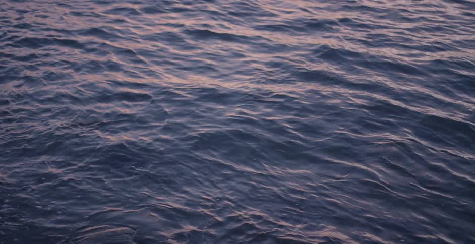 Aerial view of some wavy water below