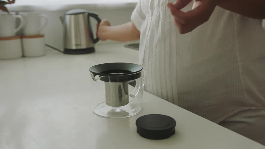 A woman preparing tea