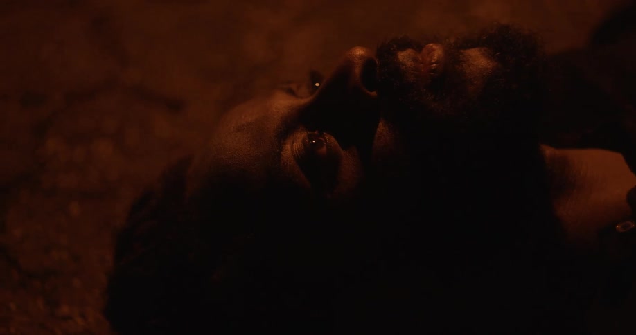 A man laying down on the ground