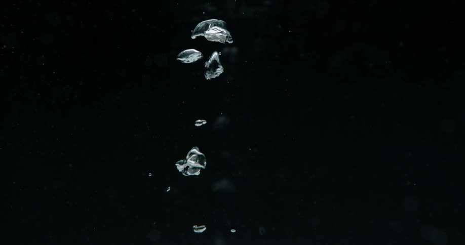 Bubbles are rising with a black background