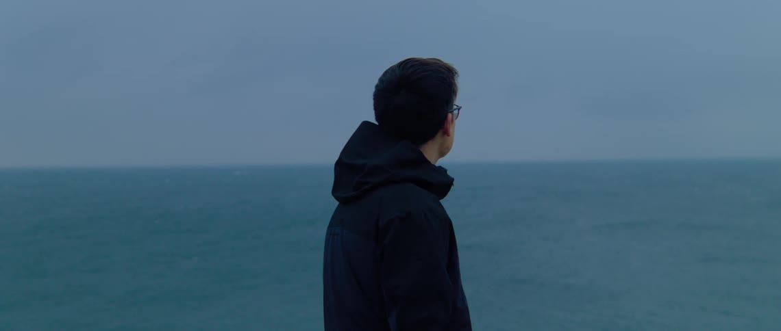 Person staring out over water