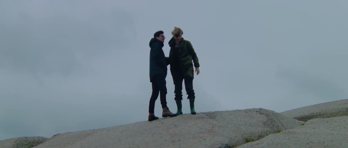 People hugging outdoors