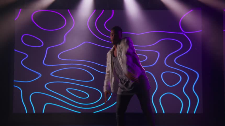 A man is dancing on the stage