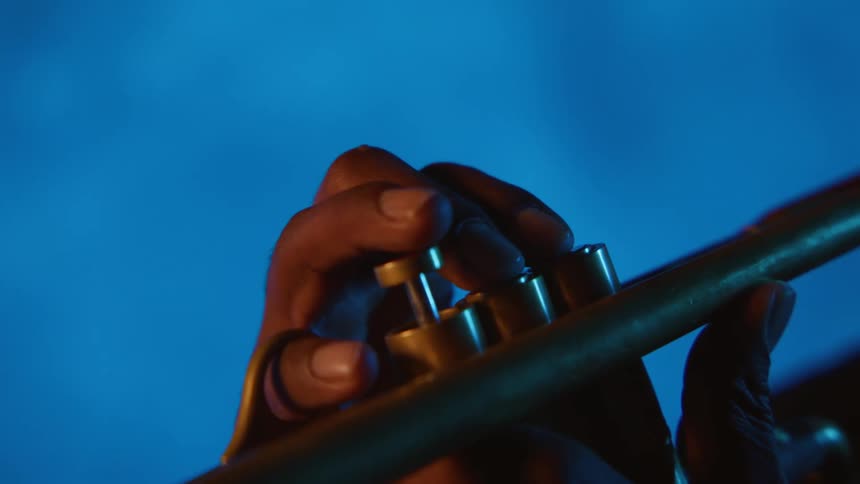 Hands playing trumpet