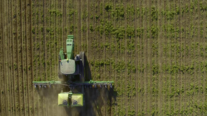 Top down view of a modern tractor planting seeds