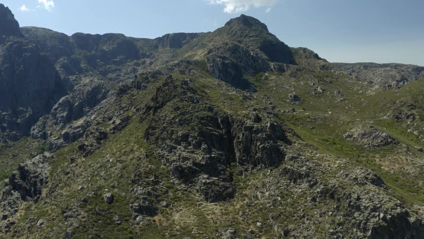 A tall mountain reaches up into the sky