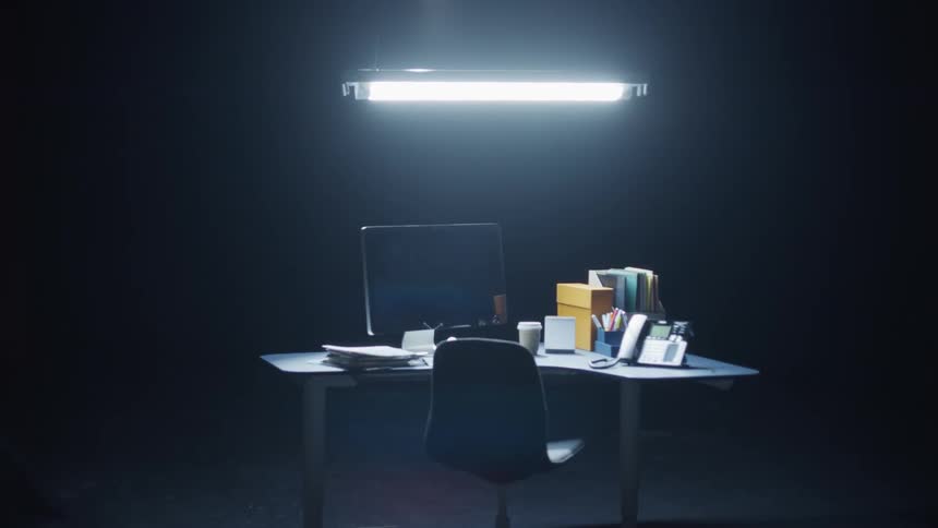 A view of a desk in a large office