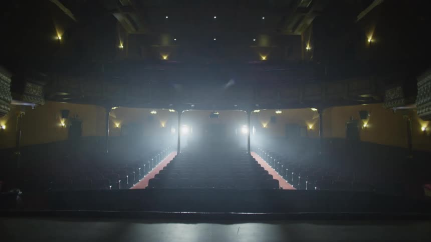 The lights turn on in a performing arts theatre