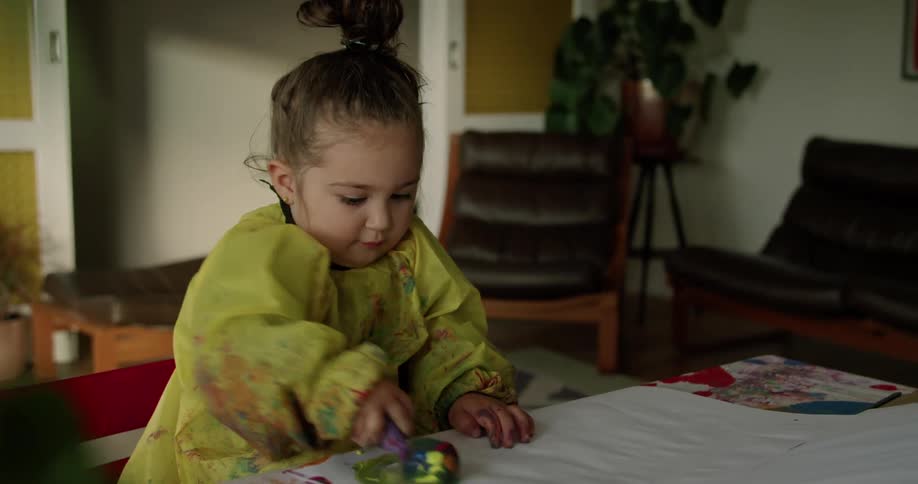 A child painting indoors