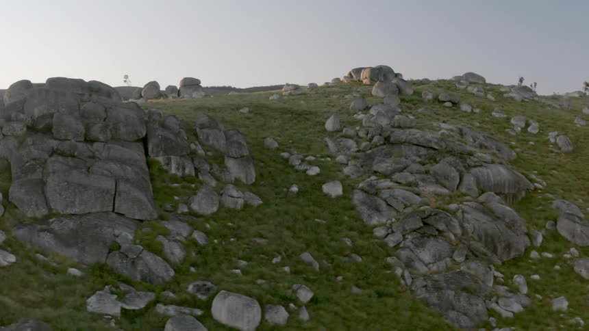 Large and small boulders line the mountain range