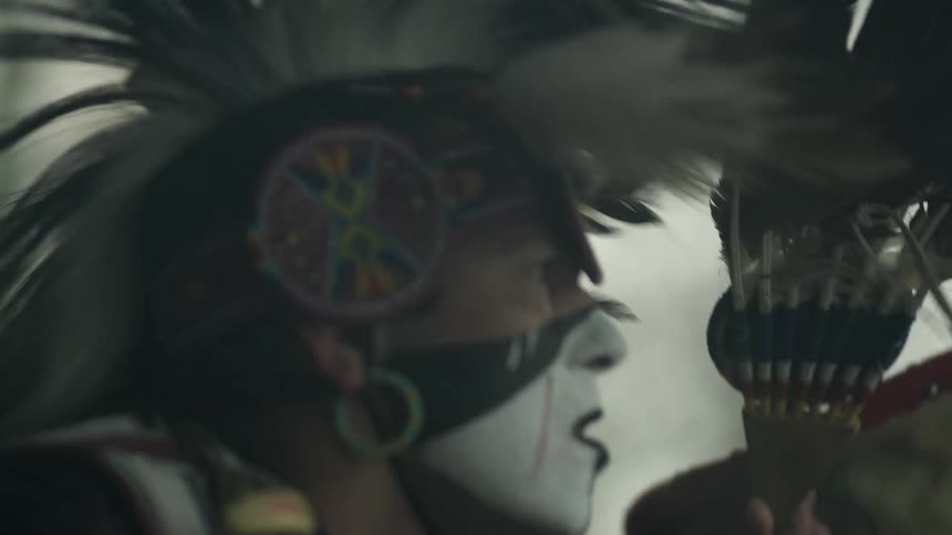 Close up of a native american warrior in ritual dress