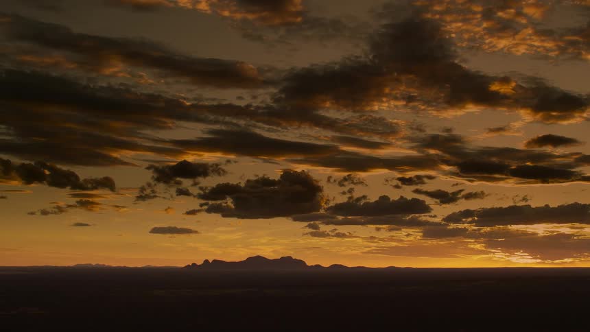 Heavy clouds cover the sky at sunset
