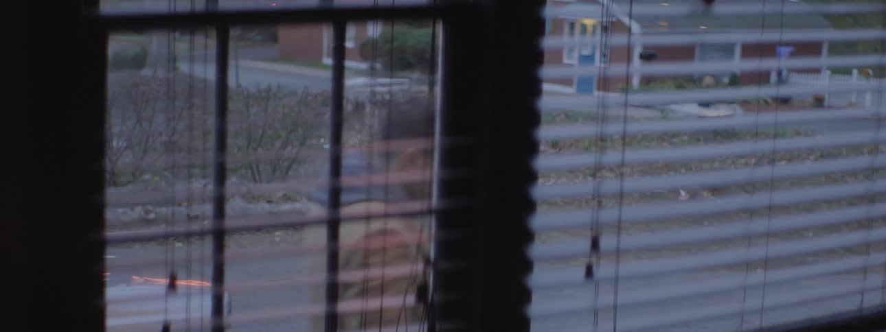 A man is seen outside window walking past