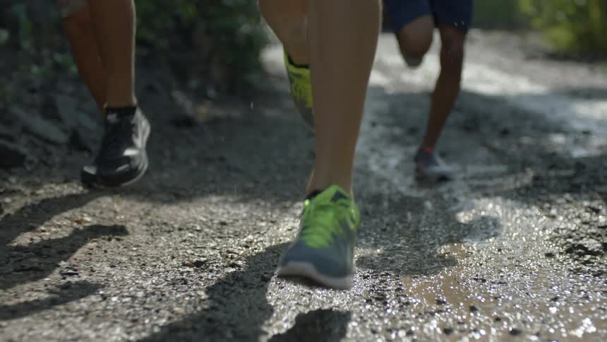 A group of people that are running outdoors