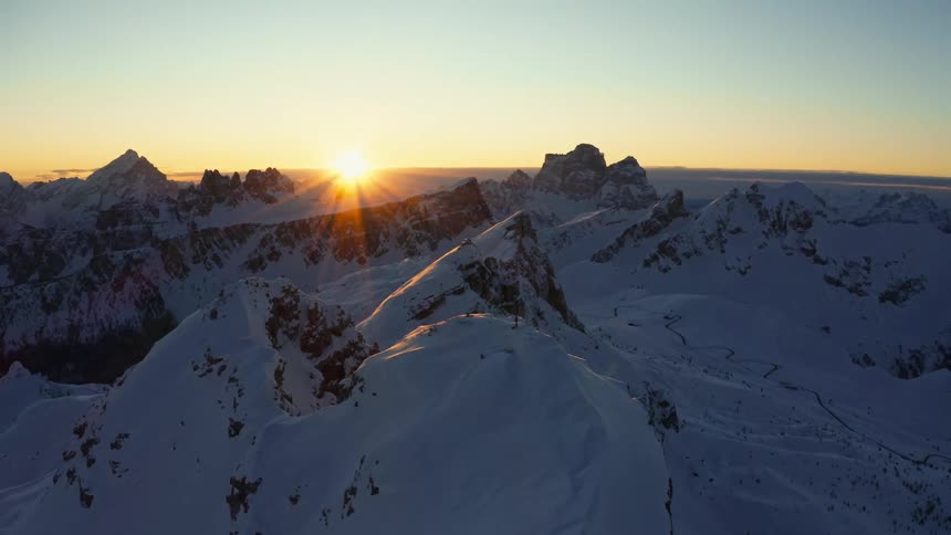 The mountain range is covered with heavy snow