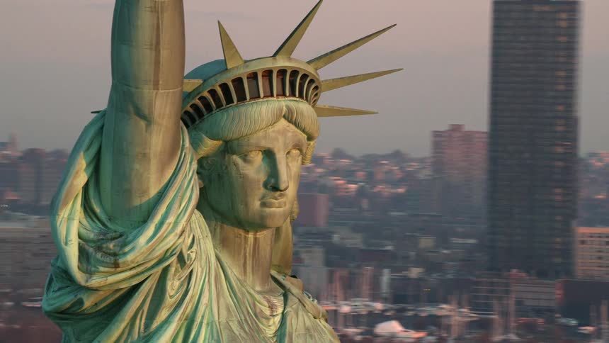 The statue of liberty in front of the city skyline