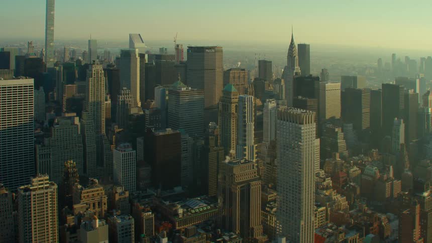 Aerial view of high rise buildings and skyscrapers at dawn