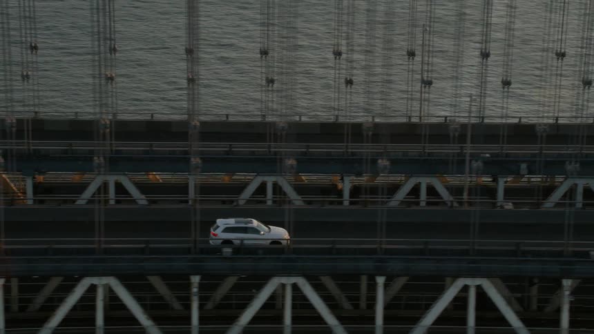 A car driving over a bridge