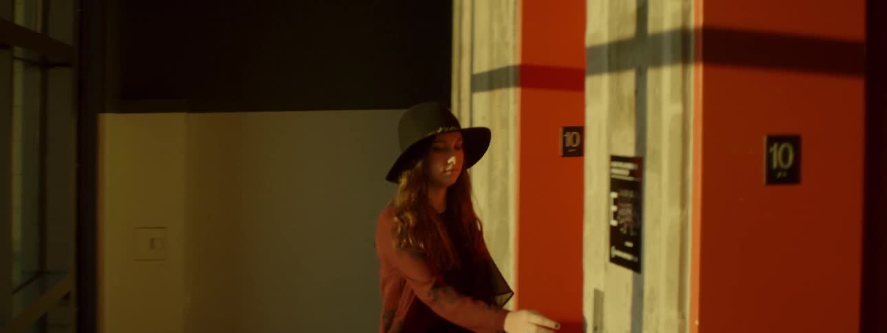 A woman pushed the button to an elevator