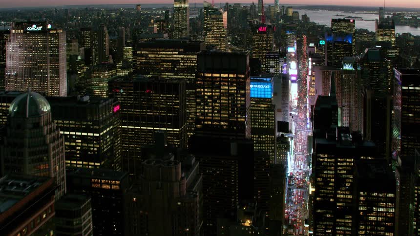 A city skyline with buildings and skyscrapers with the sky and clouds in the background