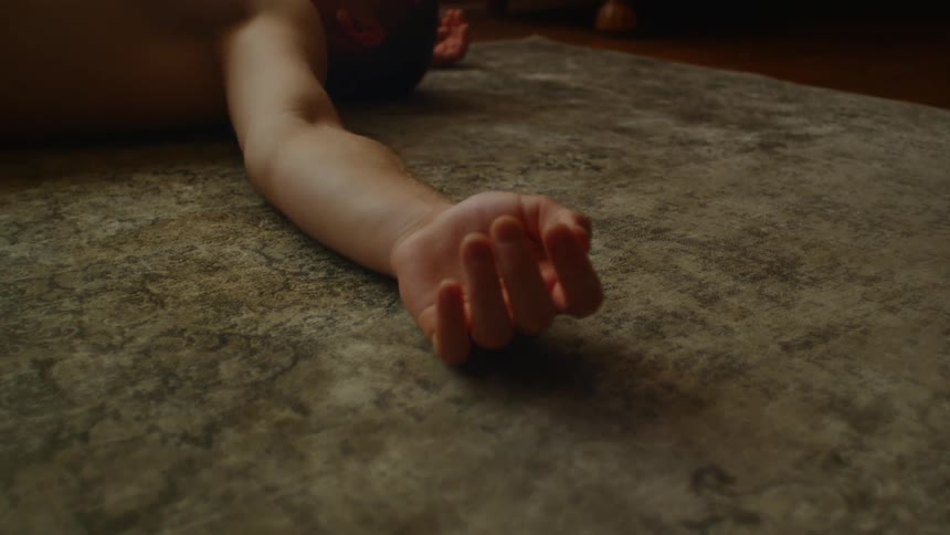A man having a seizure laying on the ground