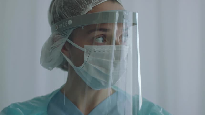 A female doctor standing in a room