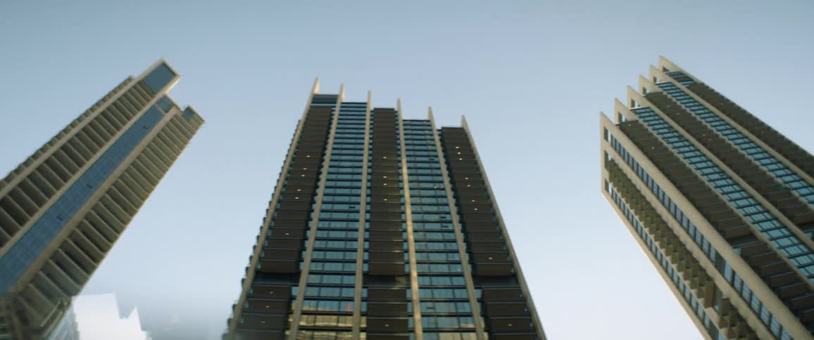 A row of skyscrapers under a clear blue sky