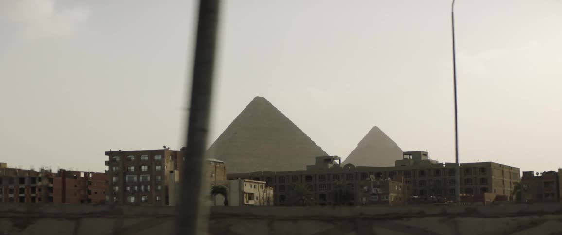 Pyramids behind building