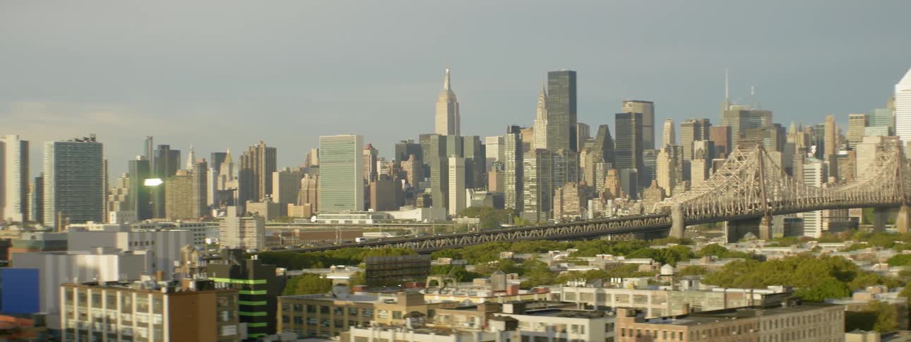 View of a large city with a bridge down the middle