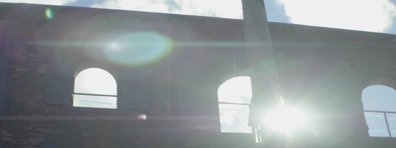Sunlight shining through windows on a wall