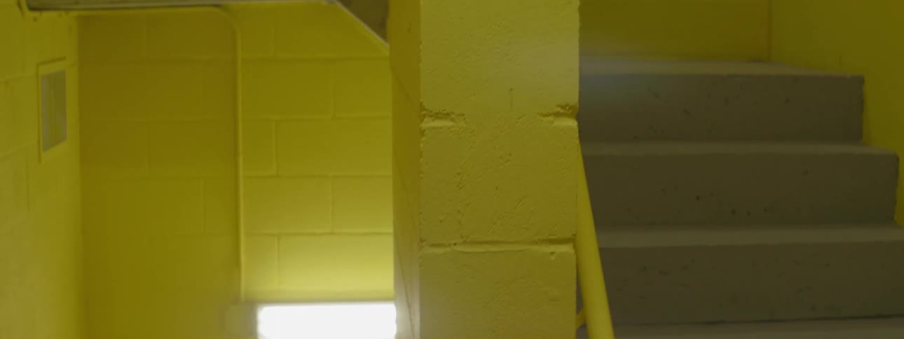 Yellow concrete walls inside a building