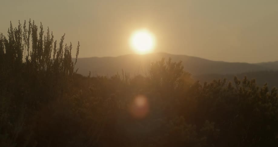 Sun setting over the mountains in the desert