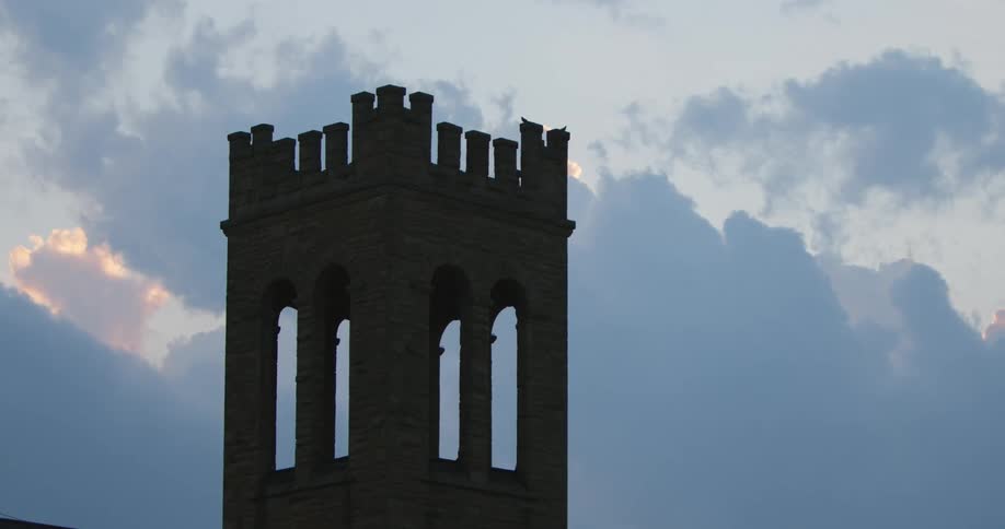 A church bell tower on a cloudy day in the evening